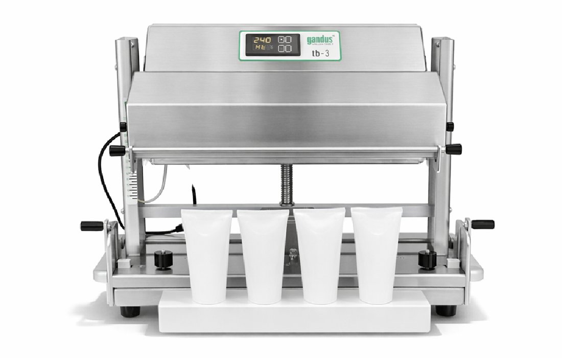 Gandus Saldatrici TB 3 tube sealer with the tb-3 display panel and four tubes loaded under the sealing jaw