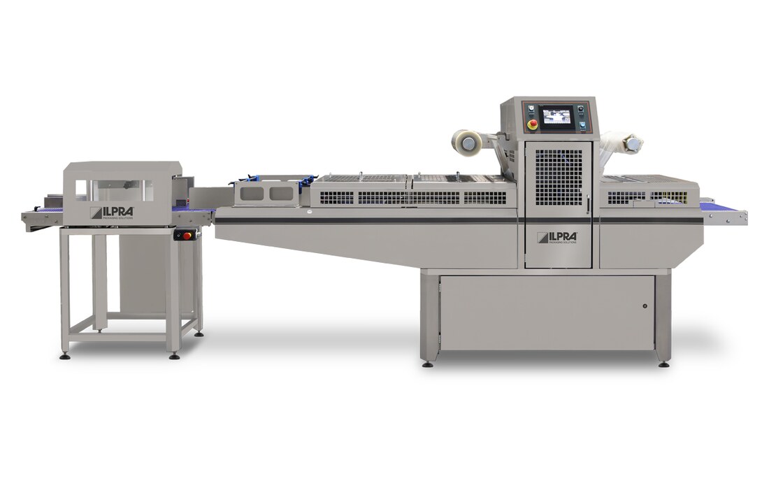 ILPRA FoodPack Speedy+ inline tray sealer with the sealing station between infeed and outfeed conveyors and a discharge unit at the end of the line
