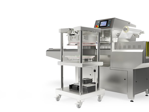 Ilpra FoodPack Speedy inline tray sealer with its tooling trolley alongside the sealing station