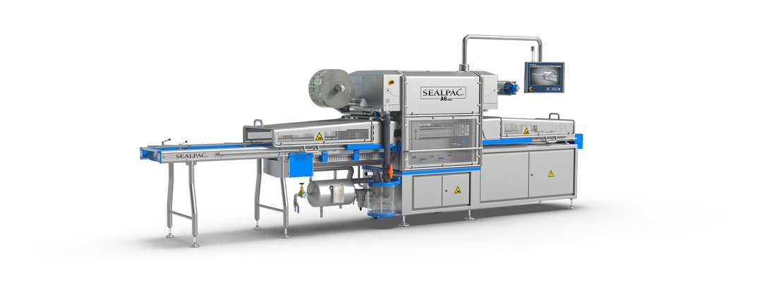Sealpac A6max inline traysealer with infeed and outfeed conveyors either side of the sealing station