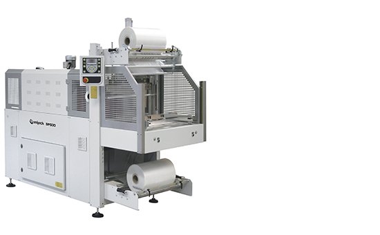 Smipack BP600 automatic shrink wrapper with the sealing bar and shrink tunnel in line and the film reel loaded below