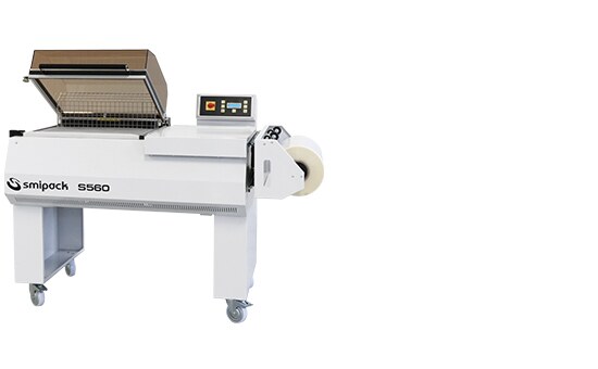 Smipack S560 L-seal hood packer on its stand with the hood raised over the L-shaped seal frame and the S560 badge on the side panel