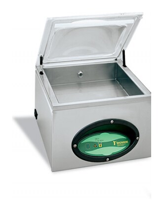 Tecnovac T100 table-top chamber vacuum machine in stainless steel with the lid raised over the wider chamber and seal bar