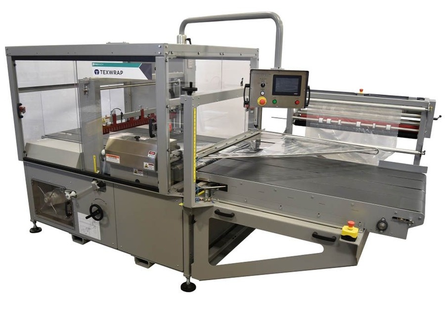 Texwrap ISS 3618 intermittent-motion side sealer with the guarded seal head raised over the infeed conveyor